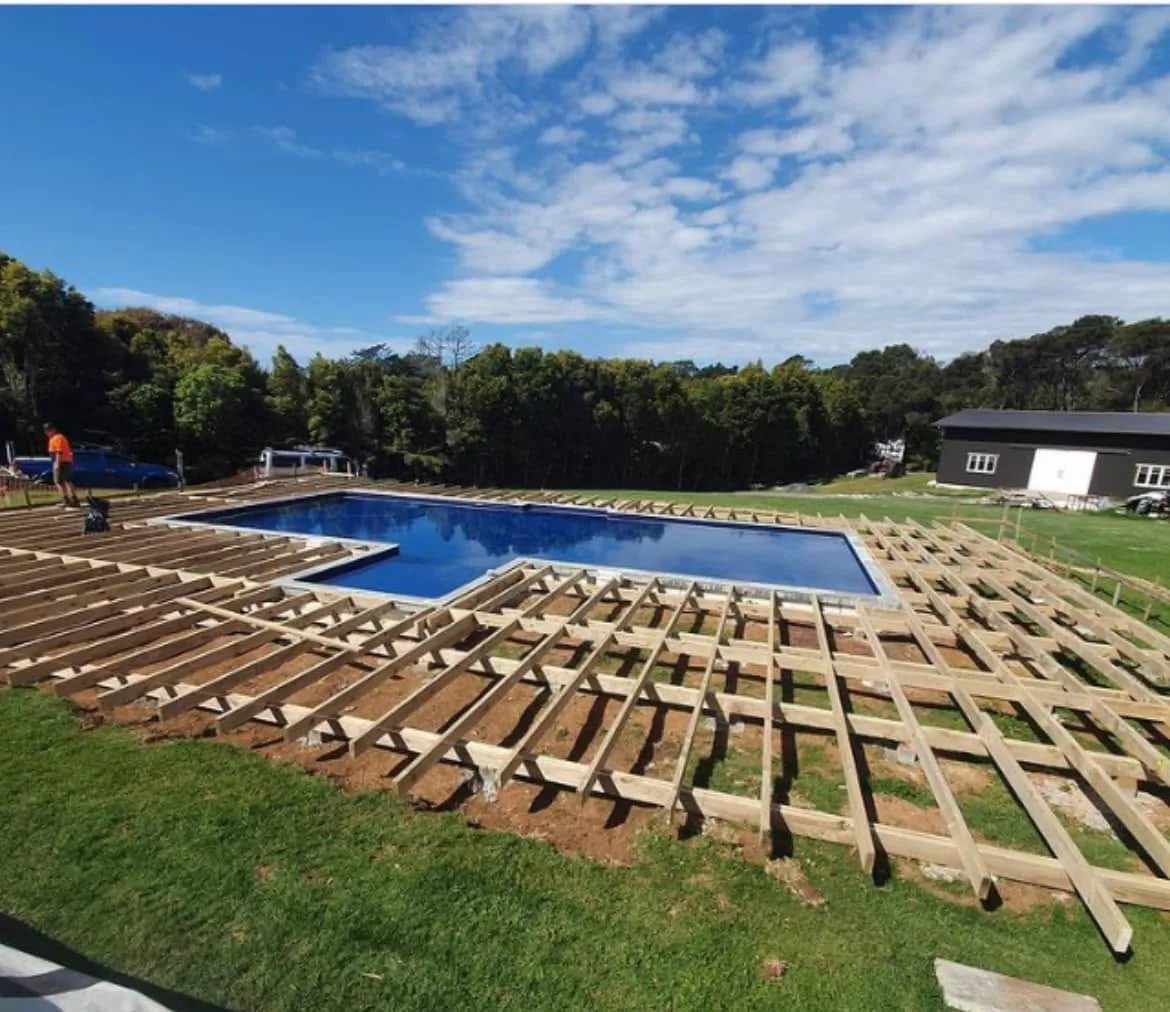 A large timber pool deck under construction by Rosser Residential